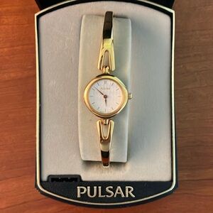 Pulsar gold watch.
